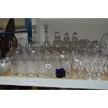 A QUANTITY OF CUT GLASSES, DECANTERS, JUG ETC