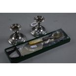 A PAIR OF DWARF SILVER CANDLESTICKS, jam spoon and cake slice