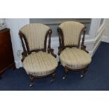 A PAIR OF VICTORIAN AESTHETIC MOVEMENT WALNUT CHAIRS, the padded back and fluted uprights to a