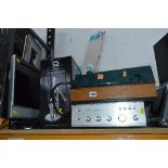 A TG TURNTABLE, and a Rotel RA-211 amplifier, a Dmtech TV, electric hedge trimmer and a box