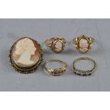 FOUR MIXED 9CT DRESS RINGS, together with a cameo brooch, approximate weight 9.6 grams