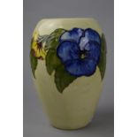 A MOORCROFT POTTERY VASE, 'Pansy' pattern on yellow ground, impressed marks to base (faint),