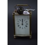 A FRENCH BRASS CARRIAGE CLOCK, height 10cm (key)