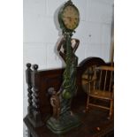 A MODERN QUARTZ JULIANO COUNTER BALANCED CLOCK/FIGURE OF A SEMI CLAD LADY AND BOY