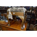 A VICTORIAN GILT PAINTED FOOTSTOOL, on ball and claw feet (sd)