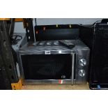A CUISINA STAINLESS STEEL MICROWAVE, and a Ferguson 19' LED TV/DVD Combi TV (no remote) (2)