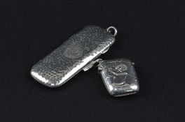 A SILVER VESTA WITH GOLFING IMAGE, and a small silver cigarette case (Chester 1911) approximate