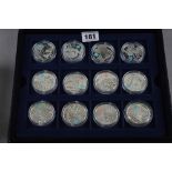 A CASED SET OF TWELVE SILVER COINS, a Celebration of Britain made for The 2012 London Games (