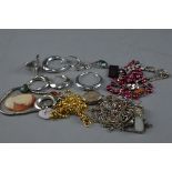 A BAG OF ASSORTED COSTUME JEWELLERY