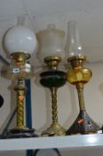THREE VARIOUS BRASS OIL LAMPS, two with shades and funnels, other with just funnel (3)