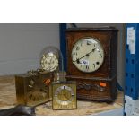 AN OAK MANTEL CLOCK, (no key or pendulum), an anniversary clock and two other timepieces (4)