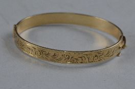 A ROLLED GOLD BANGLE