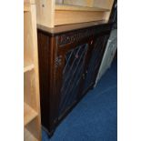 A JAYCEE OAK GLAZED TWO DOOR BOOKCASE, standing 96cm high x width 97cm