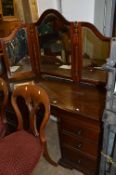A MODERN MAHOGANY DRESSING TABLE WITH A TRIPPLE MIRROR