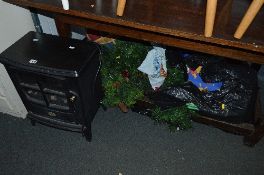 A DIMPLEX STOVE TYPE HEATER, a Christmas tree, bags of linen and a bean bag