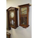 AN OAK CASED WALL CLOCK, and a mahogany wall clock (two winding keys) (2)