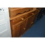 A PINE SIDEBOARD, with three drawers over three doors and a pine chest of three drawers (2)