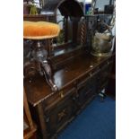 A CARVED OAK BARLEY TWIST MIRROR BACK SIDEBOARD, with three short drawers, approximate size width