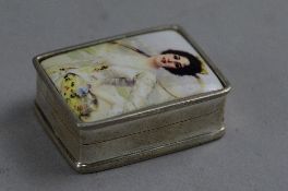 A SILVER ENAMELLED BOX, depicting an Edwardian lady with tennis racket