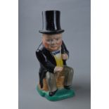 A KIRKLANDS EMBASSY WARE TOBY JUG, depicting seated Winston Churchill in a yellow waistcoat and