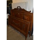 A FRENCH STYLE OAK BED FRAME, with carved foliage detailing, approximate width 153cm (with three