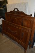 A FRENCH STYLE OAK BED FRAME, with carved foliage detailing, approximate width 153cm (with three