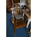 A MODERN OAK WHEEL BACK ROCKING CHAIR, and a child's rocking chair (2)