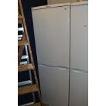 A TALL HOTPOINT FRIDGE FREEZER, height 174cm