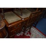 A MODERN MAHOGANY WRITING DESK, with green tooled leather inlay top and five various drawers,