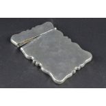 AN EDWARDIAN SILVER CARD CASE OF WAVY RECTANGULAR OUTLINE, makers F.H. Adams Ltd, Birmingham 1910,