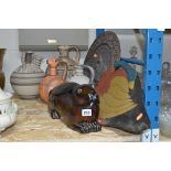 A LARGE CERAMIC POT, shaped as a Rabbit lying down, a carved circular plaque, four Continental