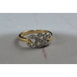A 9CT GOLD DIAMOND SET RING, ring size L, approximate weight 2.4 grams