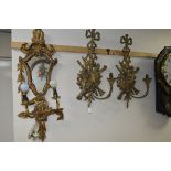 A PAIR OF GILTWOOD WALL LIGHTS, with ribbon, musical instrument and foliate scroll backs, supporting