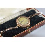 AN EARLY 20TH CENTURY LADIES 9CT GOLD WRISTWATCH, mechanical hand wound movement, case fitted to a