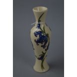 A MOORCROFT POTTERY BUD VASE, Bluebells decoration on cream ground, impressed marks to base and