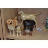 FOUR BESWICK DOGS, Dachshund No 361, black and tan, Labrador 'Solomon of Wendover' No 1548, Labrador