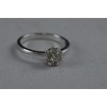 AN 18CT DIAMOND FLOWER RING, ring size M, approximate weight 3.3 grams