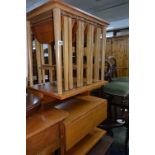 A TEAK NEST OF FIVE DROP LEAF TABLES, a teak trolley, an occasional table, sewing box, linen box and