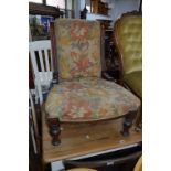 A VICTORIAN MAHOGANY NURSING CHAIR