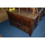 A GEORGIAN OAK TRIPLE PANEL MULE CHEST, with two short drawers bearing initials 'S T', approximate