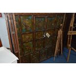 AN ORIENTAL DOUBLE DOOR CUPBOARD, the front of multi panel form, each painted with dragons, flowers,