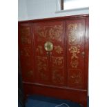 AN ORIENTAL PAINTED FOUR DOOR CUPBOARD, the exterior decorated with scenes of figures, birds and