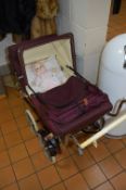 A 1950'S PEDIGREE PLASTIC DOLL, together with a refurbished 1950's doll's pram (2)