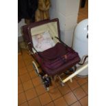 A 1950'S PEDIGREE PLASTIC DOLL, together with a refurbished 1950's doll's pram (2)