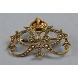 A KING GEORGE V, ROYAL PRESENTATION BROOCH, gold, 15ct marked, GVR cypher inset with enamel and