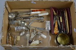 A BOX OF MISCELLANEOUS ITEMS, forks, brooches, etc