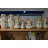 A PAIR OF CROWN DEVON 'WYE' VASES, height approximately 30.5cm, three graduating 'Etna' jugs,