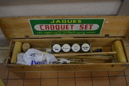 A JAQUES CROQUET SET, in pine box, with four mallets, four coloured balls (in original box), etc,