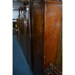 TWO WALNUT TWO DOOR WARDROBES, and an oak draw leaf table (3)