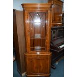 A YEW WOOD GLAZED CORNER CUPBOARD, and a single door corner cupboard (2)